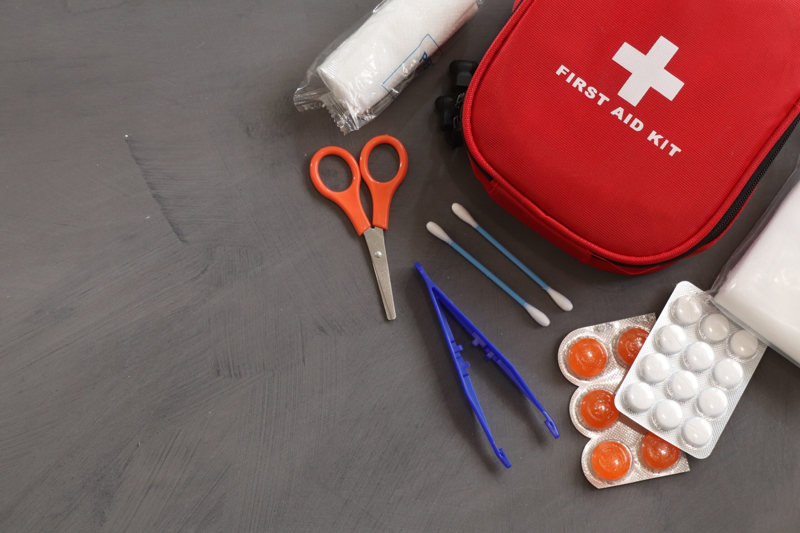 first-aid-kit-on-gray-background